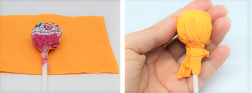 Die orangene Serviette wird um den Lolli gewickelt. 
